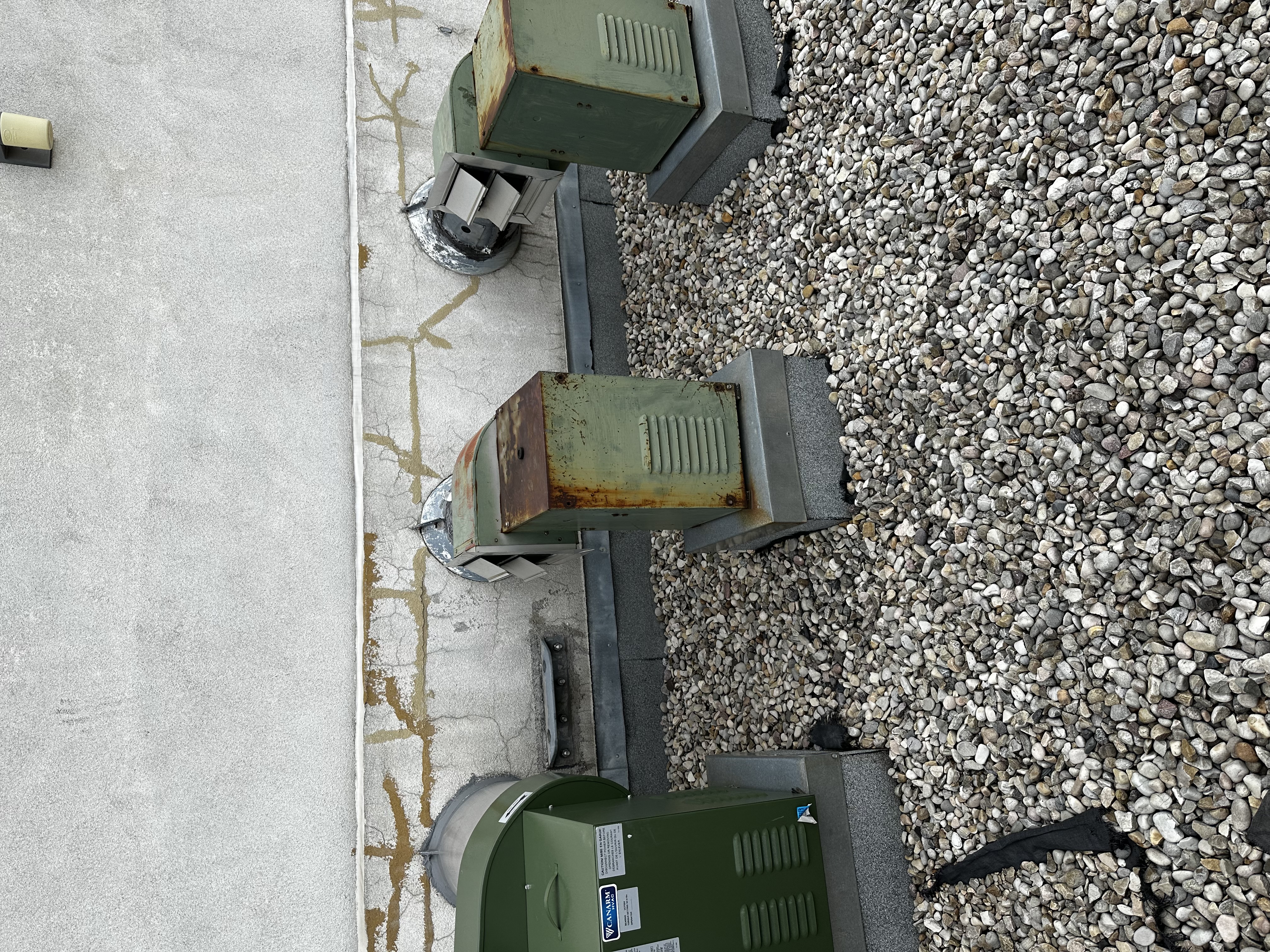 Rooftop commercial HVAC unit being cleaned at an Edmonton-area facility